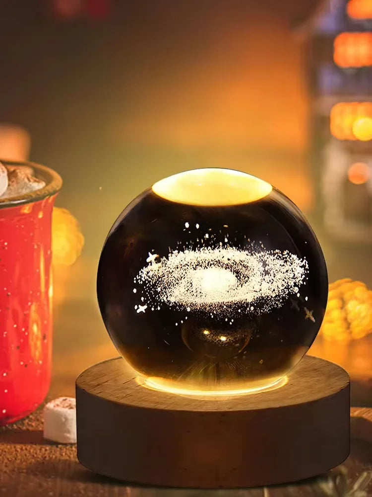 TrevioMart 3D crystal ball night light with galaxy design glowing on wooden base