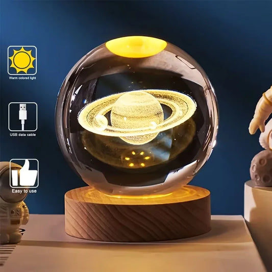 3D crystal ball night light with glowing Saturn planet design on wooden base from TrevioMart