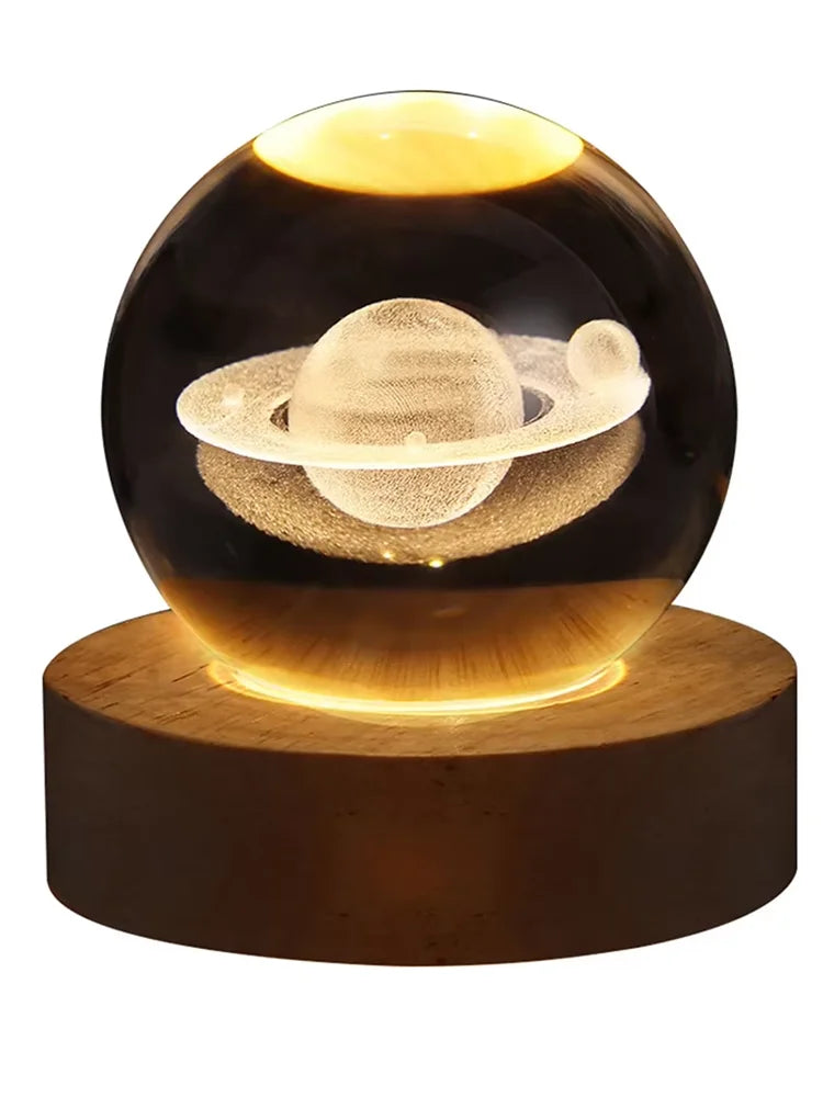 3D crystal ball night light featuring a glowing Saturn planet design on wooden base
