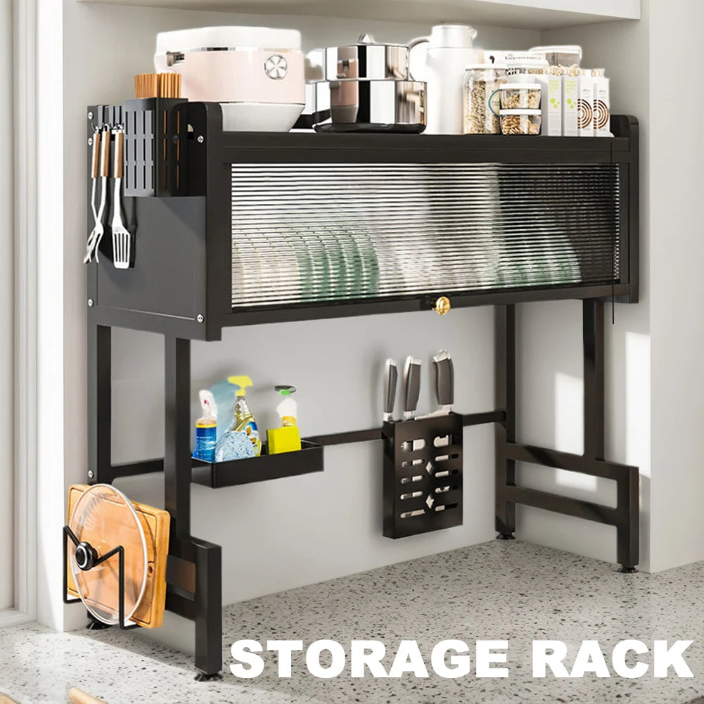 Black over the sink dish rack with storage holding dishes, kitchen utensils, and containers on countertop