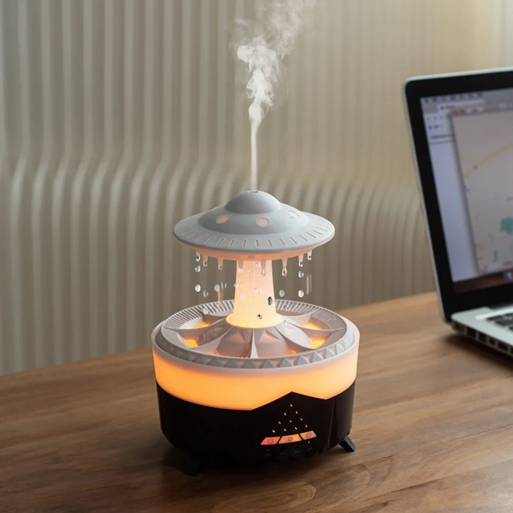 TrevioMart raindrop air humidifier with UFO design emitting mist on wooden desk next to laptop
