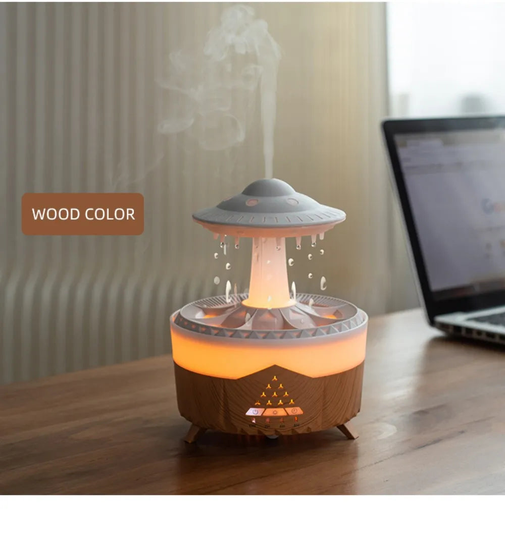 Wood color raindrop air humidifier with mist and warm light on wooden table next to laptop