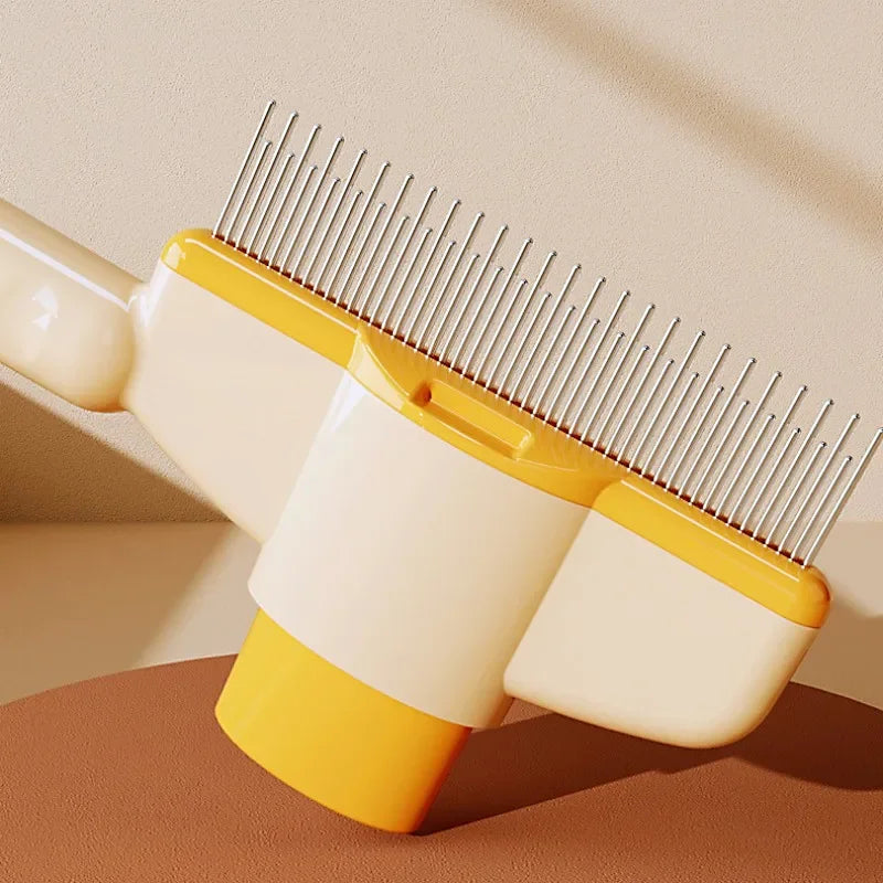 TrevioMart yellow and white self-cleaning pet grooming brush with metal bristles on a brown surface
